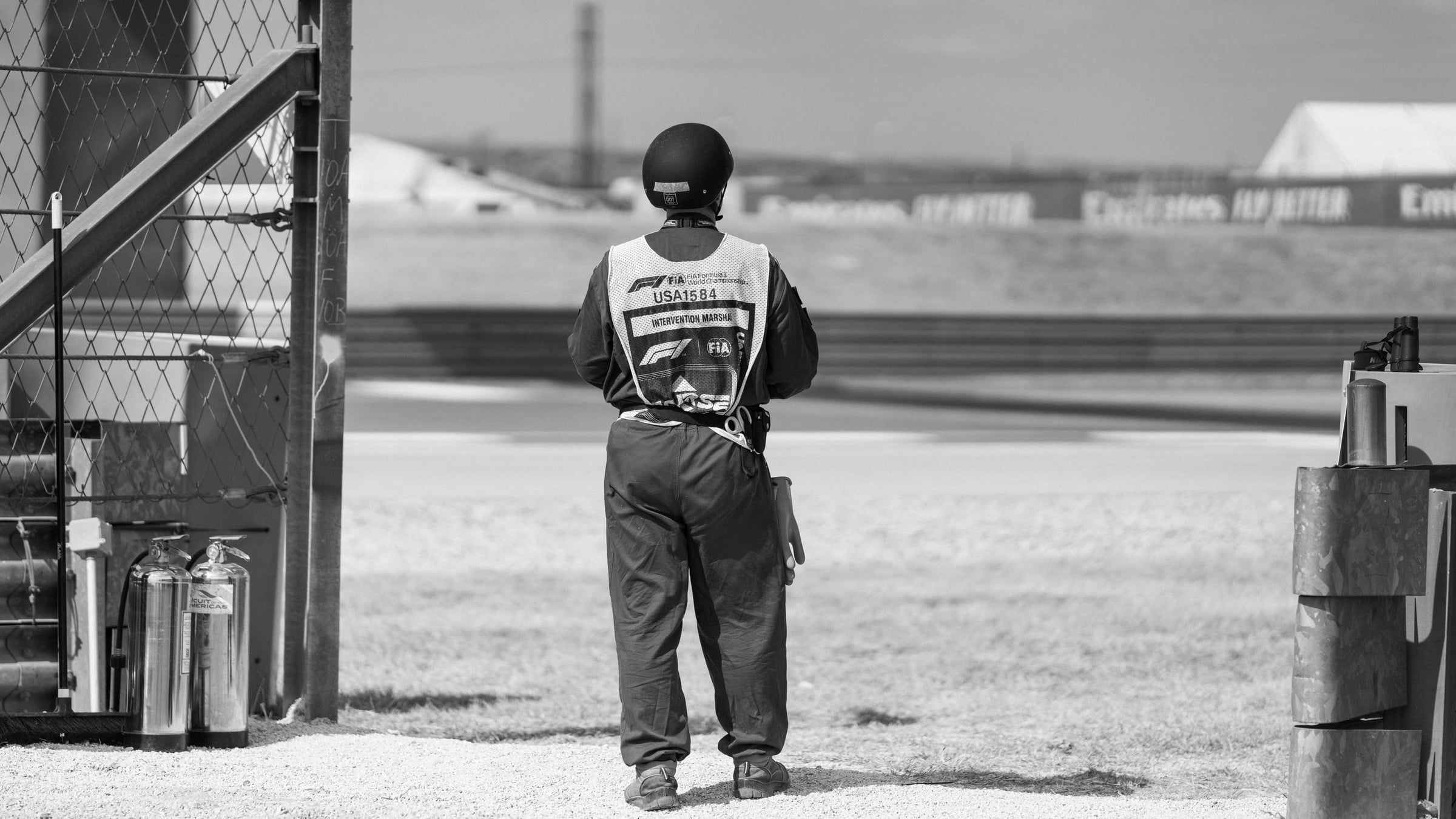 FIA intervention marshal at Circuit of the Americas trackside, F1 United States Grand Prix Austin TX — editorial black and white motorsports photography by Chauncey Scott