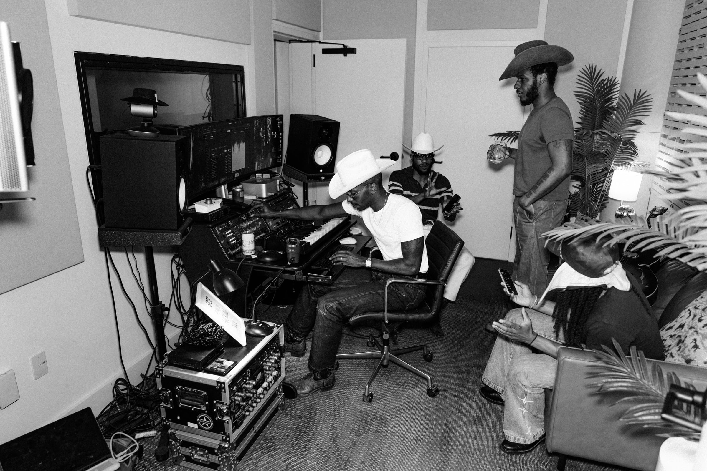 Recording-studio session with Leon Bridges, The Bros Fresh and Brandon Marcel — black-and-white documentary photograph in the control room, Austin TX — Chauncey Scott