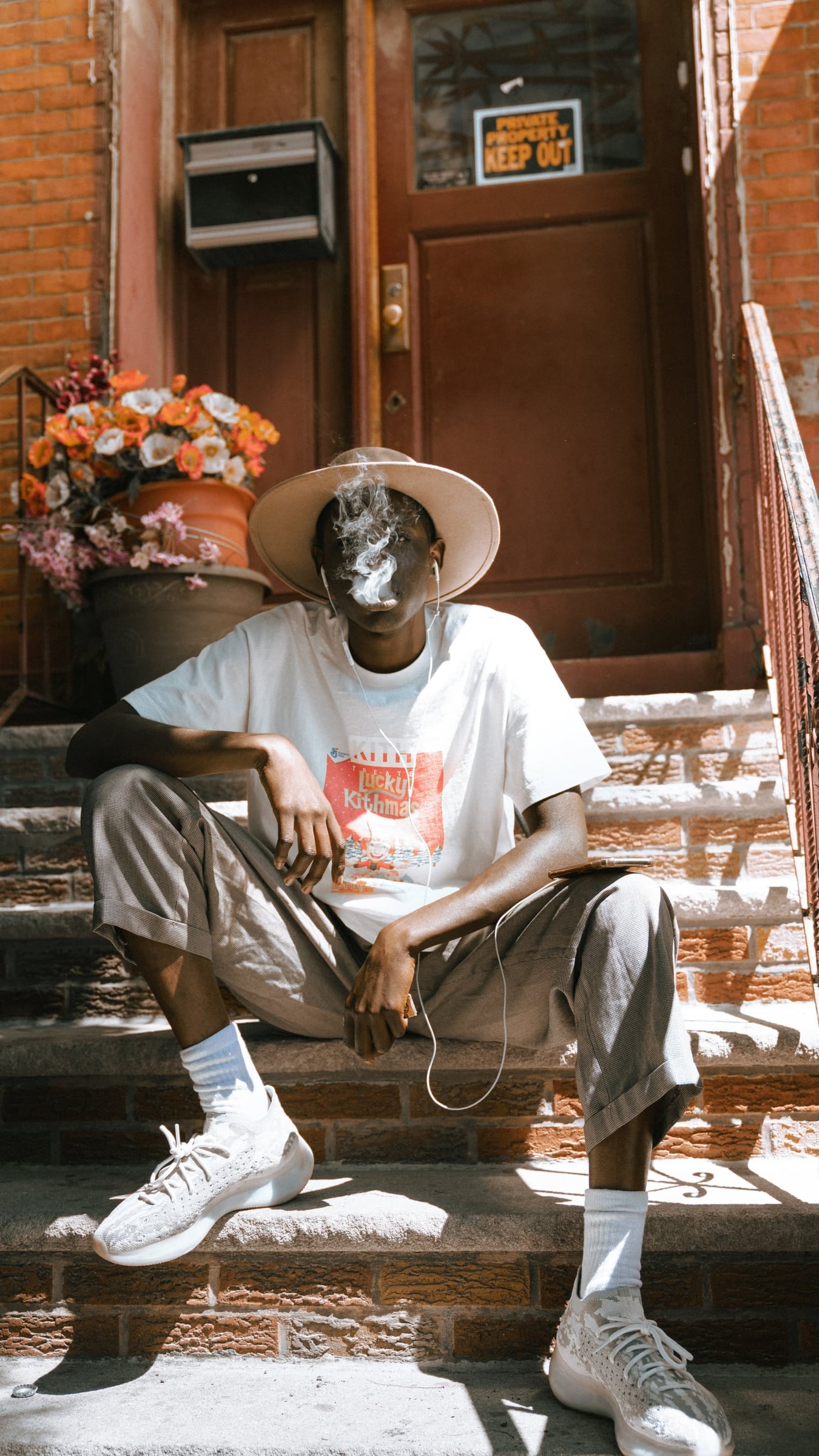 Joe West editorial portrait on Williamsburg brownstone stoop, New York City — street and portrait photography by Chauncey Scott, commercial portrait photographer