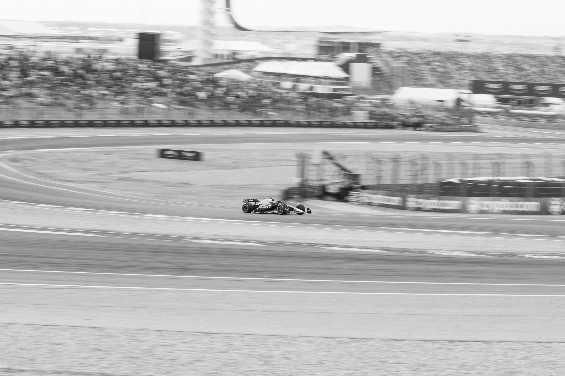 Red Bull Oracle Racing F1 car at Circuit of the Americas, wide COTA circuit and grandstands, F1 United States Grand Prix Austin TX 2023 — editorial sports photography by Chauncey Scott